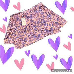 Pink Universal Thread skirt with blue and purple floral design & ties on side.
